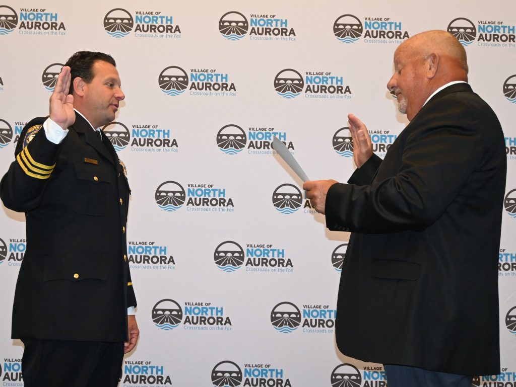 Mayor Mark Gaffino (R) issues the Oath of Office to Chief Joe DeLeo